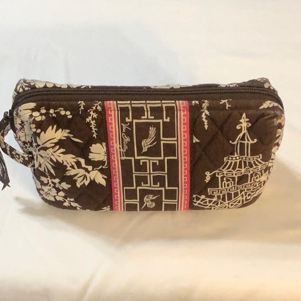 Vera Bradley brown and white floral makeup bag with zippered closure.